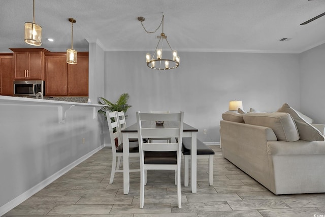 4200 Coquina Harbour Dr Unit H3, Little River, SC 29566 - dining space featuring wood finish floors, a chandelier, crown molding, and a ceiling fan