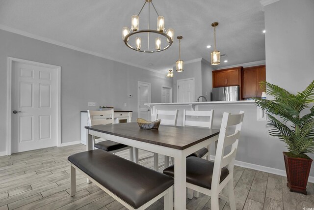 4200 Coquina Harbour Dr Unit H3, Little River, SC 29566 - dining area with light wood-style floors, a chandelier, crown molding, and recessed lighting