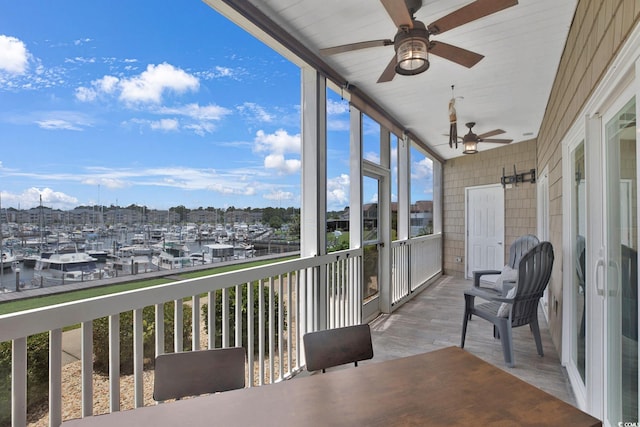 4200 Coquina Harbour Dr Unit H3, Little River, SC 29566 - sunroom / solarium featuring ceiling fan, view of marina, wood finished floors, and a water view
