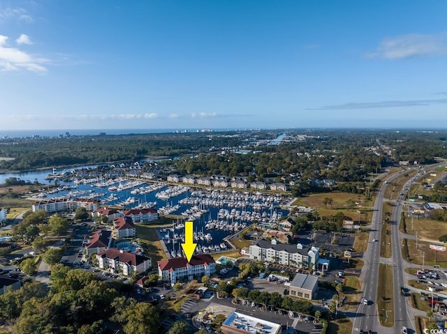 birds eye view of property featuring a water view