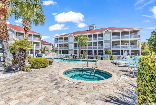4200 Coquina Harbour Dr Unit H3, Little River, SC 29566 - community pool featuring a hot tub and a patio