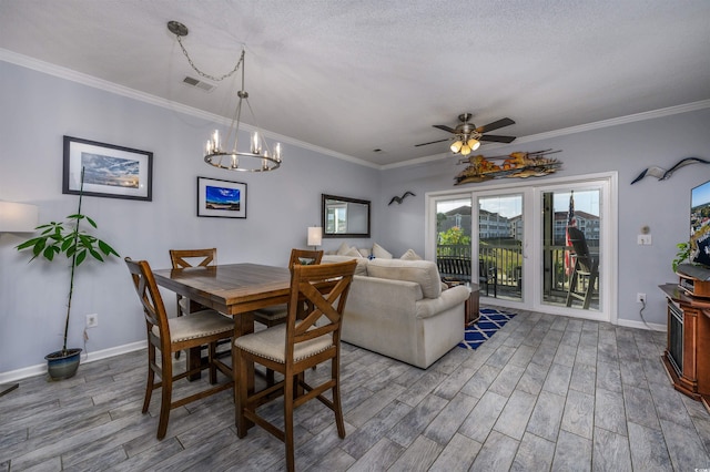 dining space with ornamental molding, a textured ceiling, and ceiling fan