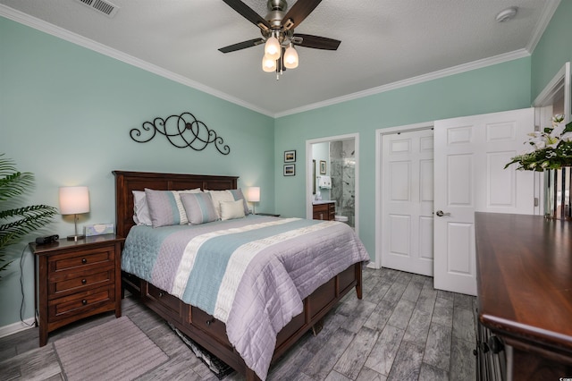 bedroom with wood-type flooring, connected bathroom, ceiling fan, and crown molding