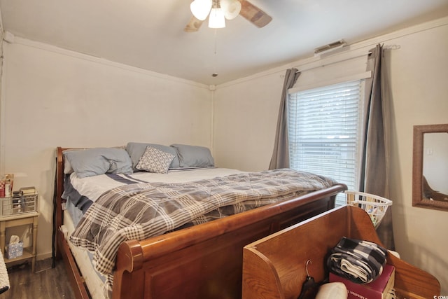 bedroom featuring ceiling fan and dark hardwood / wood-style flooring