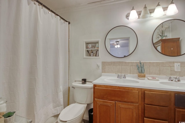 bathroom with a shower with curtain, crown molding, vanity, decorative backsplash, and toilet