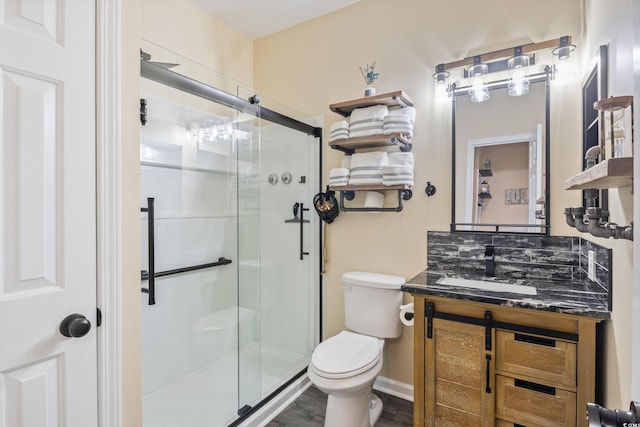 4609 Lightkeepers Way Unit 11J, Little River, SC 29566 - bathroom with wood finished floors, a shower stall, toilet, and vanity