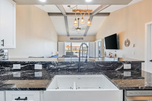 4609 Lightkeepers Way Unit 11J, Little River, SC 29566 - kitchen featuring dishwasher, a sink, white cabinetry, open floor plan, and lofted ceiling