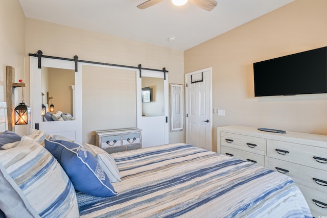 4609 Lightkeepers Way Unit 11J, Little River, SC 29566 - bedroom featuring a barn door and ceiling fan