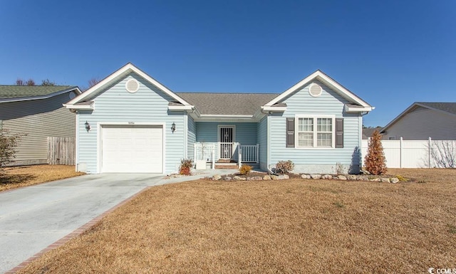 ranch-style home with a garage and a front lawn