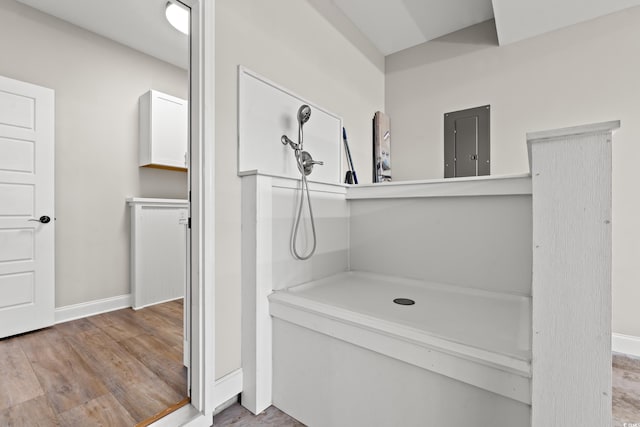 bathroom featuring wood finished floors and baseboards