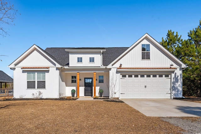 modern inspired farmhouse featuring a porch and driveway