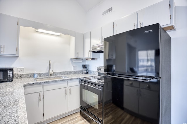 kitchen with sink, white cabinets, and black appliances