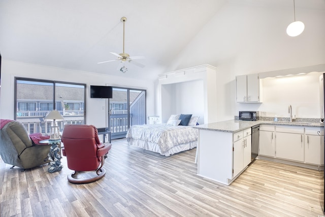 kitchen with high vaulted ceiling, light hardwood / wood-style flooring, stainless steel dishwasher, kitchen peninsula, and white cabinets