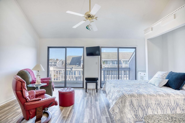 bedroom with hardwood / wood-style flooring, access to outside, and ceiling fan