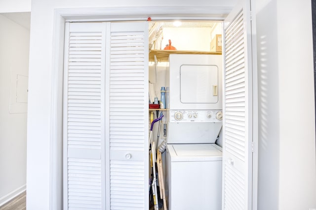 laundry area featuring stacked washer and clothes dryer