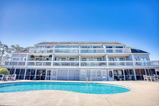 view of swimming pool with a patio