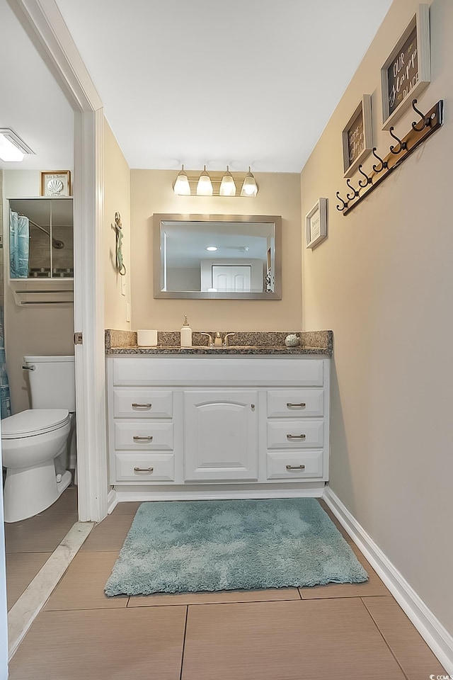 bathroom featuring vanity, toilet, and wood-type flooring