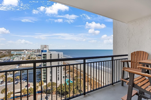 balcony featuring a water view