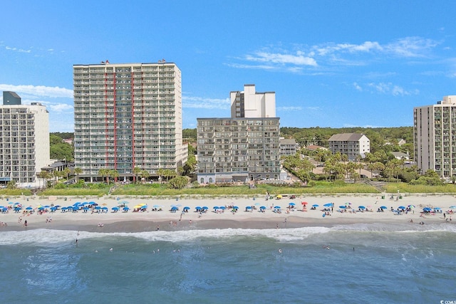 bird's eye view featuring a view of the beach and a water view