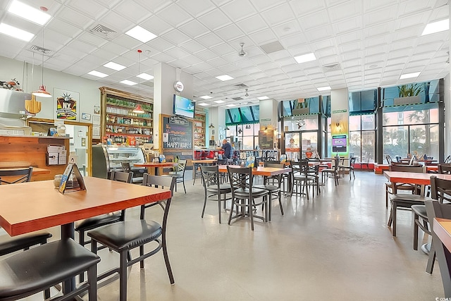 dining area featuring floor to ceiling windows