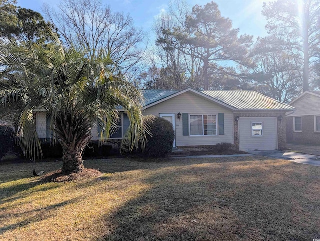 view of front of property with a standing seam roof, brick siding, metal roof, and a front yard