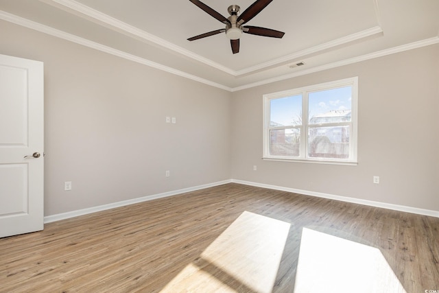 unfurnished room featuring ceiling fan, ornamental molding, and light hardwood / wood-style floors