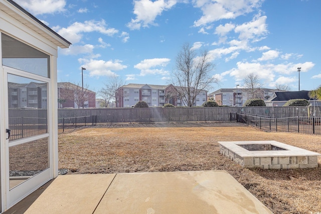 view of yard with an outdoor fire pit and a patio area