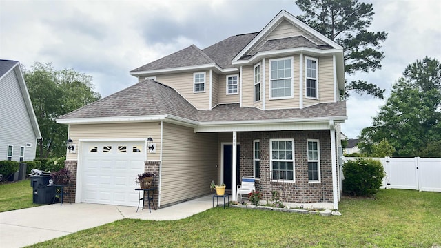 view of front of house featuring a garage and a front yard