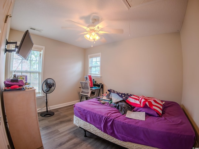 bedroom featuring hardwood / wood-style flooring and ceiling fan