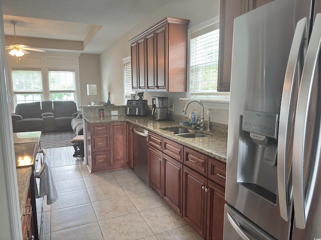 788 Rambler Ct, Myrtle Beach, SC 29588 - kitchen with stainless steel appliances, plenty of natural light, a ceiling fan, and light tile patterned floors