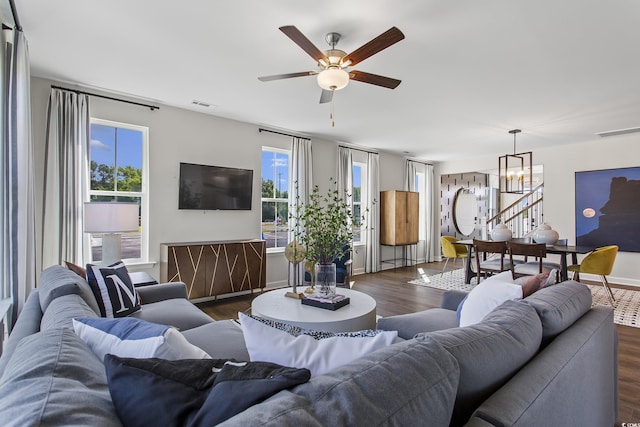 4023 Bucolic Loop, Myrtle Beach, SC 29588 - living area featuring a chandelier, dark wood-style flooring, healthy amount of natural light, and a ceiling fan