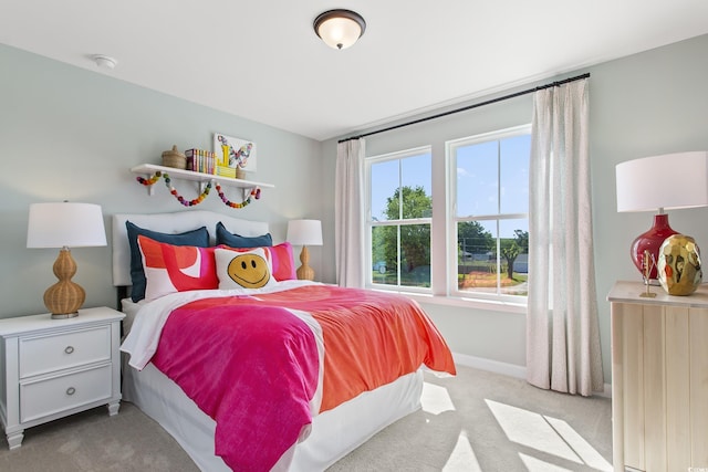 bedroom featuring light colored carpet