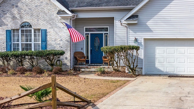 doorway to property featuring a garage