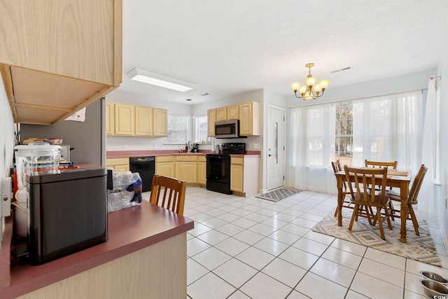 kitchen with sink, black appliances, light tile patterned flooring, light brown cabinetry, and a chandelier