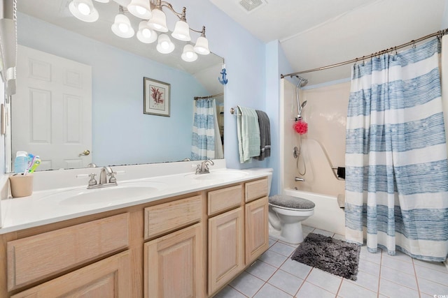 full bathroom with tile patterned floors, toilet, shower / bath combo with shower curtain, and vanity