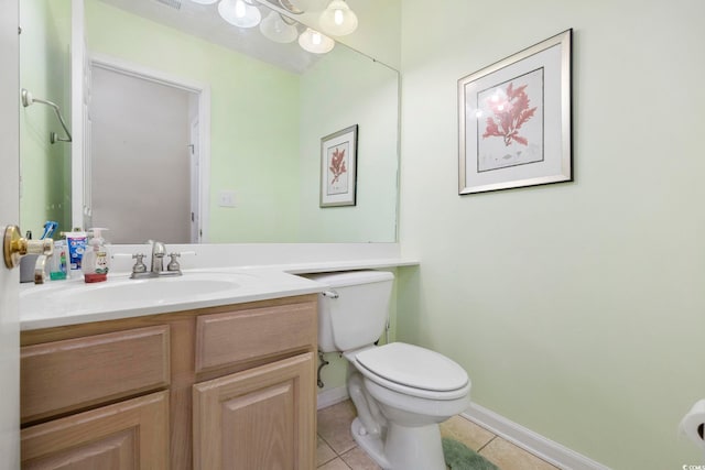 bathroom featuring tile patterned floors, toilet, and vanity