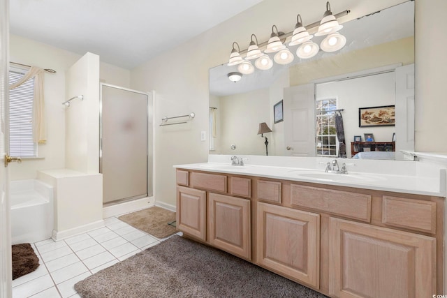 bathroom with tile patterned floors, separate shower and tub, and vanity