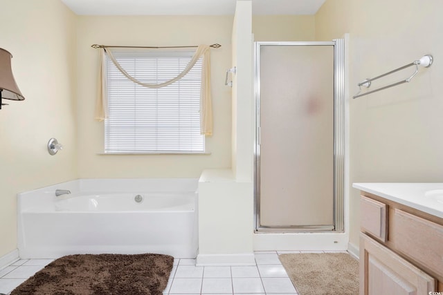 bathroom with vanity, independent shower and bath, and tile patterned flooring