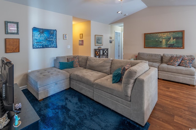 living area with vaulted ceiling and dark wood finished floors