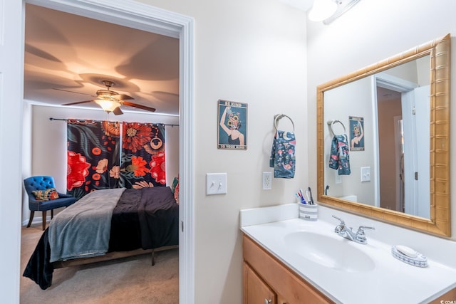 bathroom with ceiling fan and vanity