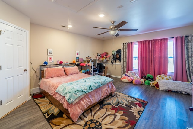 bedroom with recessed lighting, wood finished floors, a ceiling fan, baseboards, and attic access