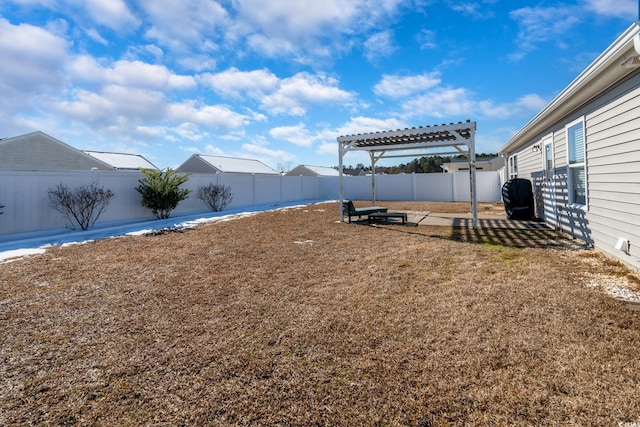 view of yard featuring a fenced backyard and a pergola