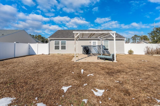 rear view of house featuring a patio, a yard, and a pergola