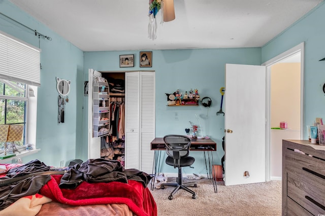 bedroom with carpet floors, a closet, and ceiling fan