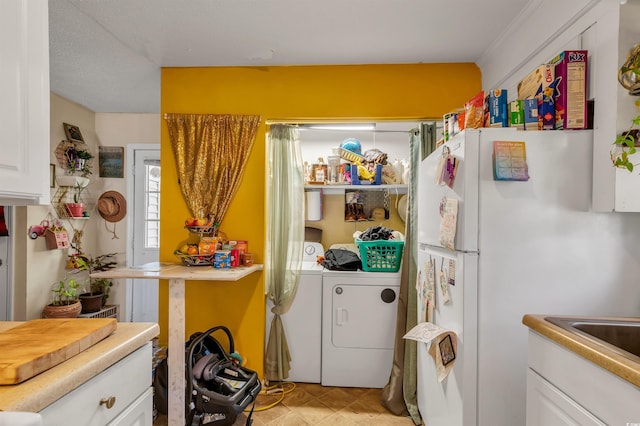 laundry area with separate washer and dryer