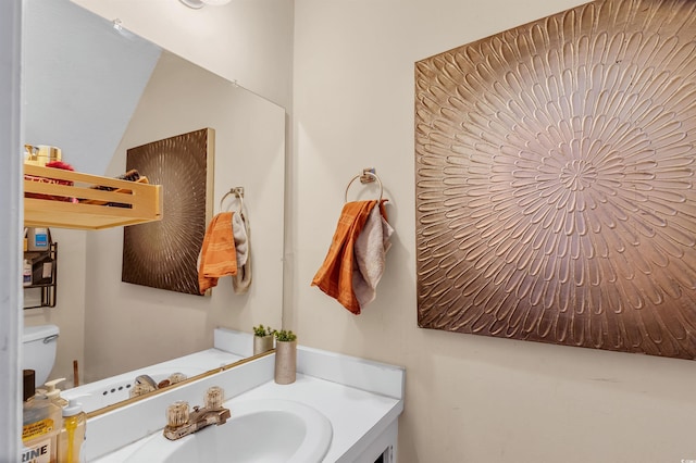 bathroom with vanity and toilet