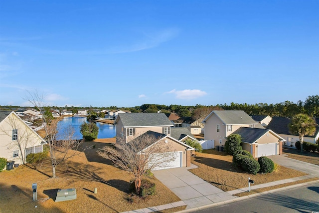 view of front facade featuring a water view and a garage