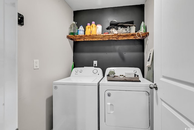 washroom with washing machine and dryer