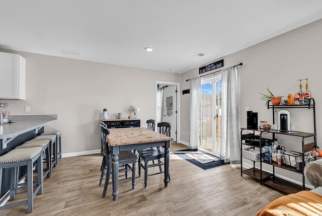 dining space featuring light hardwood / wood-style floors