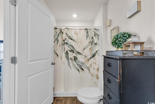 bathroom featuring toilet and hardwood / wood-style floors